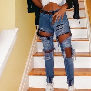 PacSun Light wash distressed jeans with zippers.